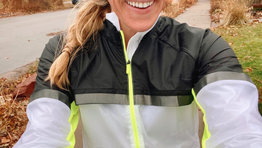 Runner taking a selfie wearing the Brooks Running Carbonite Jacket